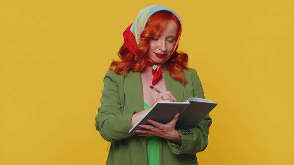 Thoughtful Journalist Redhead Woman Making Notes Writing Down Thoughts with Pen Into Notebook Diary