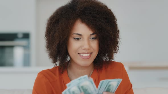Portrait Indoors Wealthy Happy Smiling Exited Successful African American Woman Counting Dollar