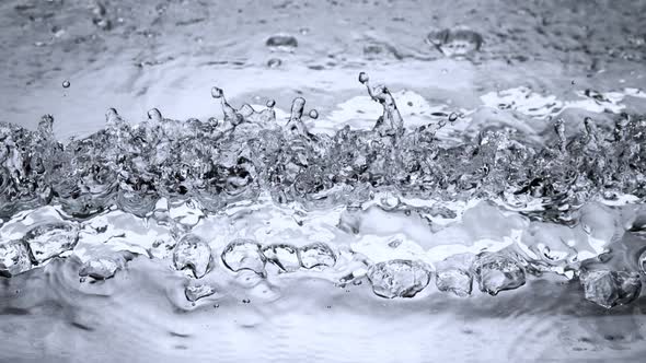 Super Slow Motion Shot of Crashing Two Water Waves and Making Linear Splash at 1000Fps alt