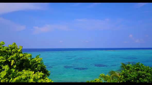 Aerial tourism of marine resort beach lifestyle by blue ocean with white sandy background of a picni