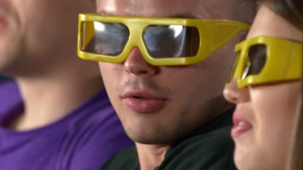 Group Of Teenage Friends Watching 3D Film In Cinema