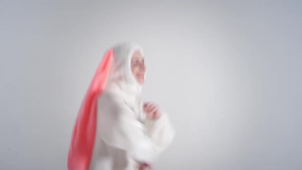 Portrait of a young cute girl in a beautiful hare costume