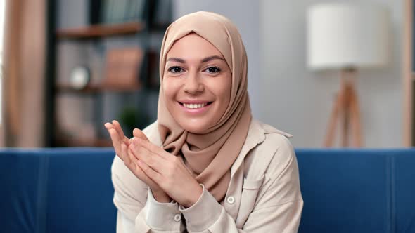 Beauty Cute Smiling Muslim Woman in Beige Hijab Posing with Positive Emotion Home Closeup Portrait