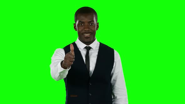 Businessman Showing a Thumbs. Green Screen