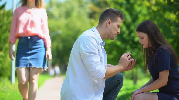 Handsome Man Making Proposal to Girl Watching at Passing Near Woman, Macho