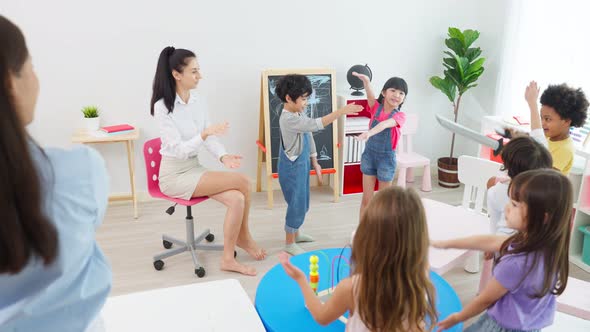 Asian beautiful young woman teacher teaching a lesson to kid at school.