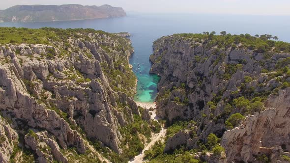 Aerial travel drone view of clear green water, cliffs of Cassis, Mediterranean Sea, Southern France.