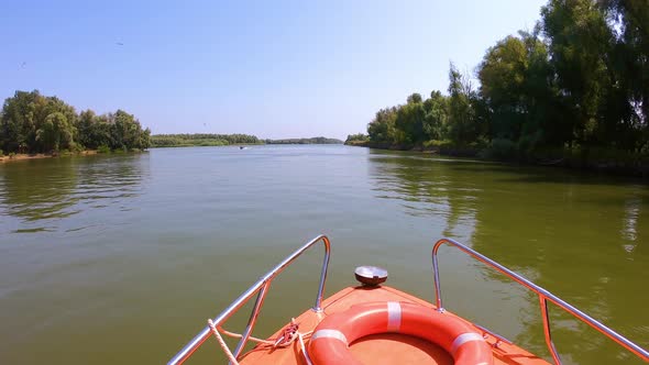 High Speed Boat Navigating in the Sfantu Gheorghe arm of Danube River, Romania