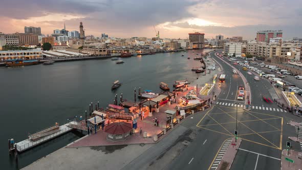 Day to Night Night Timelapse of Old Dubai Creek with Traditional Abras