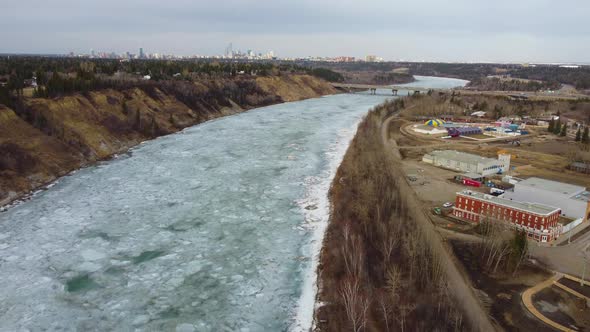 Fly over North Saskatchewan River with downtown Edmonton in background
