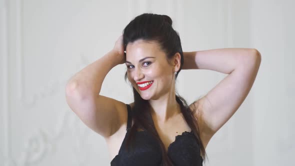 Beautiful Smiling Girl in Black Bra Posing