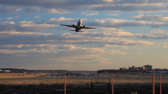 Airplane take off from runway - Arlington, Virginia - Evening