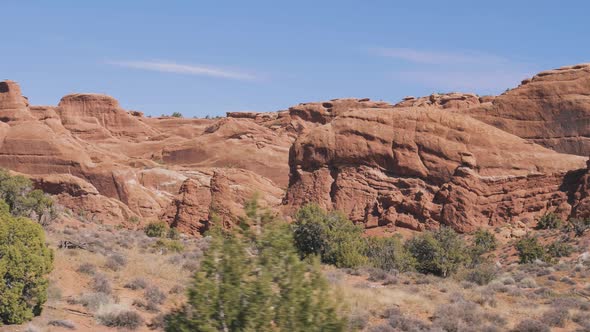 Red Orange Monolithic Rocks Formation In Arches Park On Sunny Day In Motion