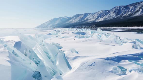 Ice Hummocks on Baikal Lake in a Sunny Frosty Day