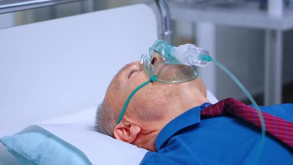 Sick Old Man in Respiratory Mask