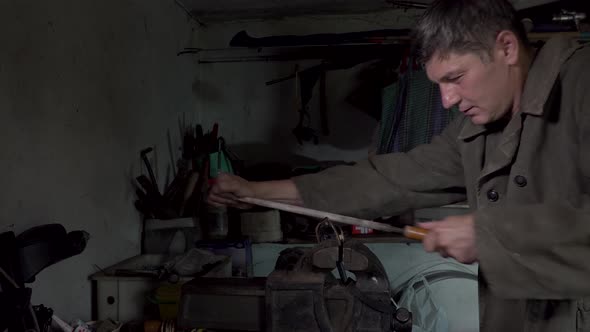 A Man Works in an Old Home Workshop