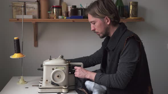 Handsome Man Tailor Working on Furrier Machine in Workshop