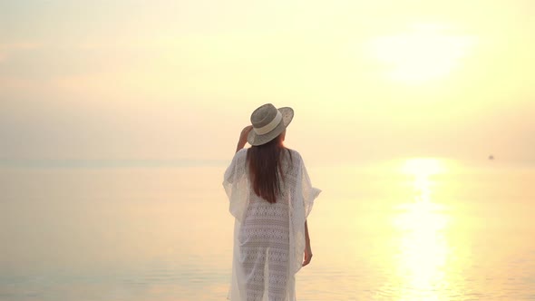 Asian woman enjoy around beautiful beach sea ocean