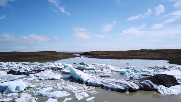 Climate change. Melting glacier in Iceland. Icebergs melt at turquoise ocean bay. Polar nature.