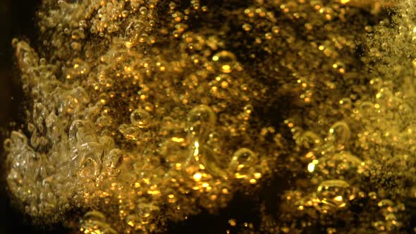 Extreme close-up beer bubbles in glass, Slow Motion