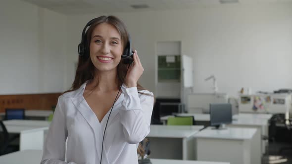 Slow Motion of a Young Business Woman with Headphones