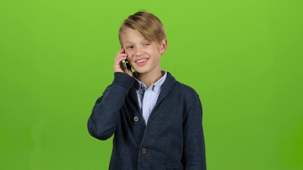 Boy Is on the Phone. Green Screen
