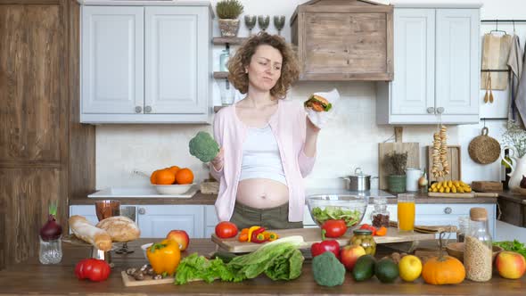 Portrait Of Pregnant Woman With Junk Food And Healthy Food