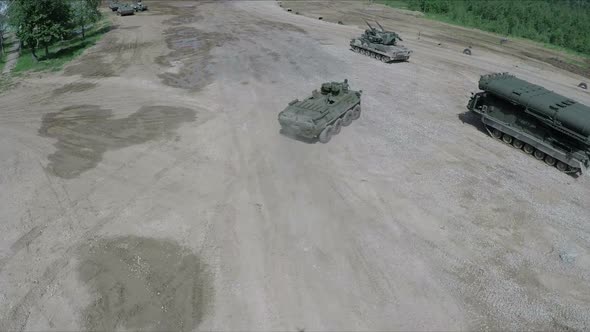 Flying Over Military Vehicles on Shooting Ground