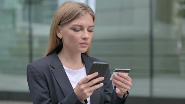 Young Businesswoman Talking on Phone Outdoor