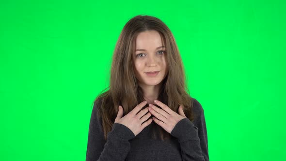 Portrait of European Young Woman with Brown Hair Is Pointing Herself, Say Who Me No Thanks i Do Not