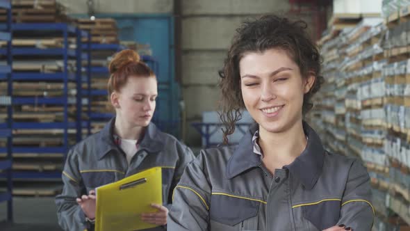 Beautiful Cheerful Female Factory Worker Smiling to the Camera
