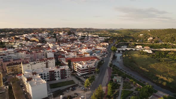 Aerial orbit shot over Silves town and Arade River in the Algarve, Portugal