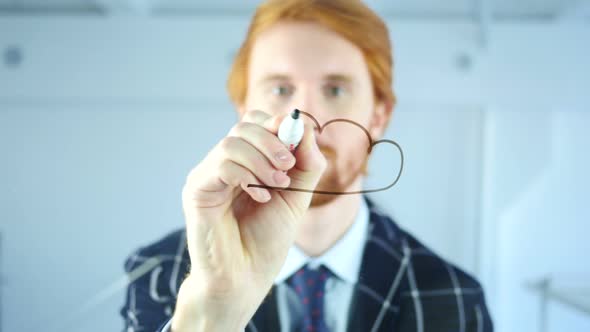 Man Drawing Cloud Computing Concept on Transparent Glass in Office