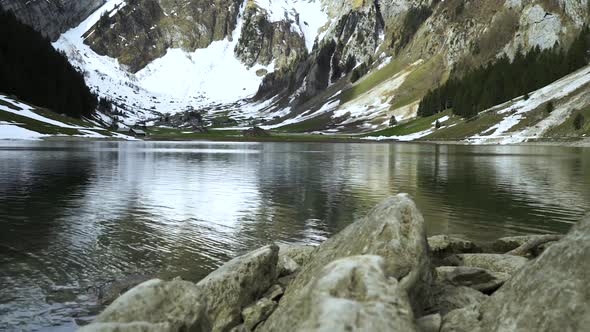 Lake On A Background Of Rocky Snowy Mountains