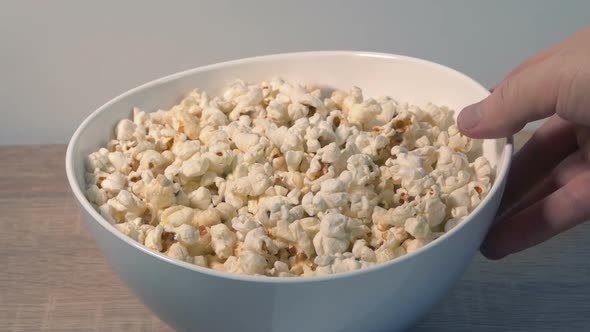 Bowl Of Popcorn Put Down Or Picked Up Off Table