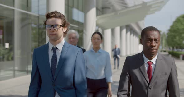 Waist Up Portrait of Diverse Business People Walk Outside Office Building