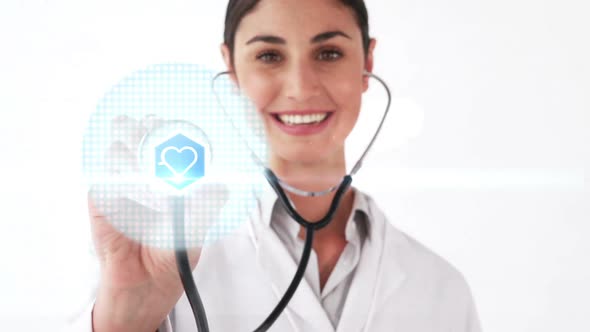 Smiling doctor holding stethoscope that shows various icons