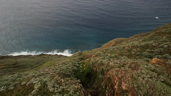 FPV Racing Drone Mountain Surfing and Cliff Diving Along the Rocks