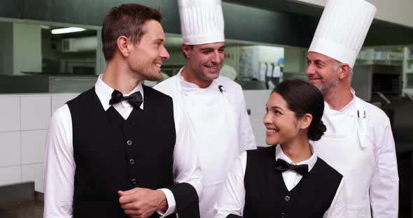 Happy Restaurant Staff Smiling at Camera