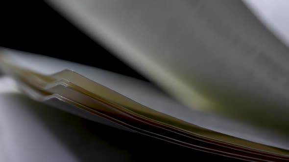 Open Book in the Studio on a Black Background