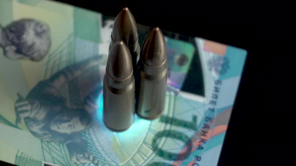 Machine Gun Bullets on 100 Russian Rubles Banknote War and Economy Concept