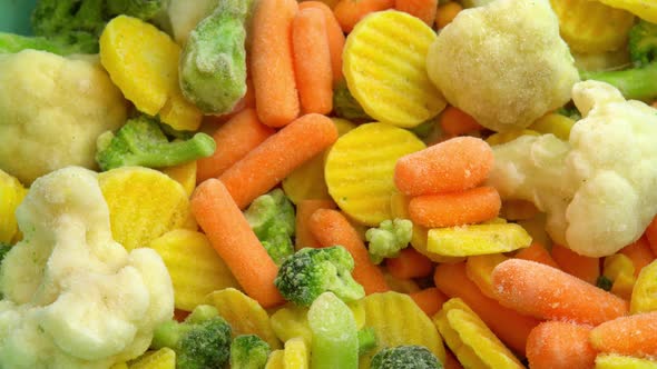 Fresh Frozen Vegetables Rotating for Background Healthy Food or Diet Food for Vegetarians and Vegans