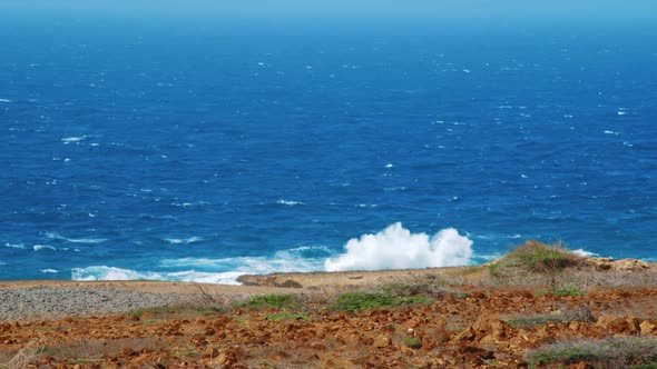 Waves crashing against desert shore on Curacao Northcoast, Caribbean Slow Motion