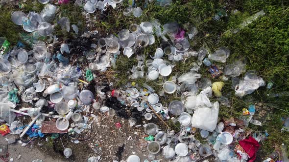 Aerial ascending look down rubbish plastic waste