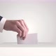 Voting. Hand Putting a Ballot into a Voting Box. - VideoHive Item for Sale