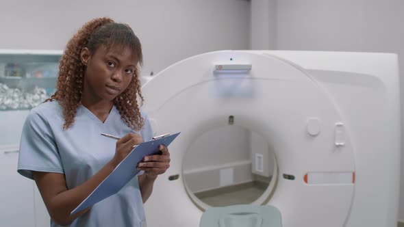 Black Female Radiologist in CT Scan Room