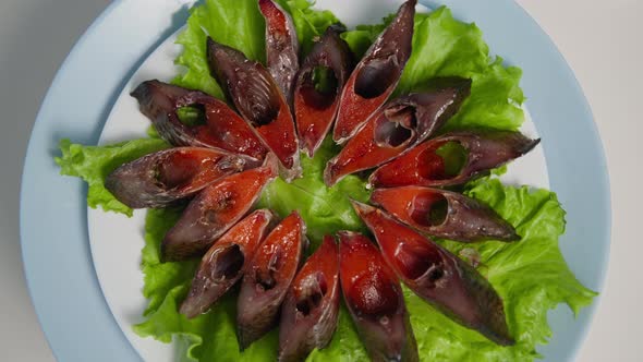 Seafood Delicious Juicy Pieces of Salted Fish with Caviar are Laid Out on Lettuce Leaf on Plate and