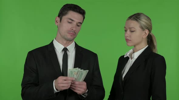 Serious Male and Female Business Professionals Arguing About Money Distribution Chroma Key