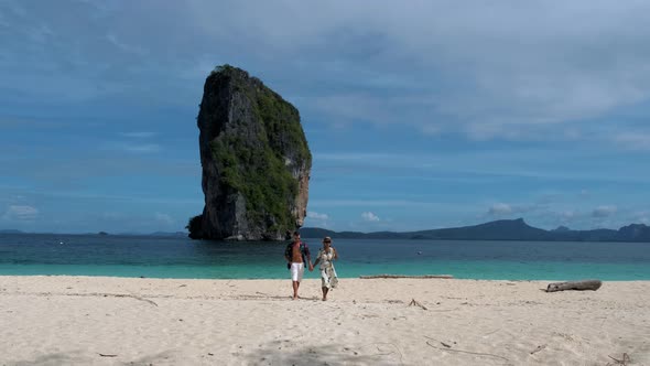 Koh Poda Beach Krabi Thailand Couple Asian Woman and European Men Walking on the Tropical Beach of