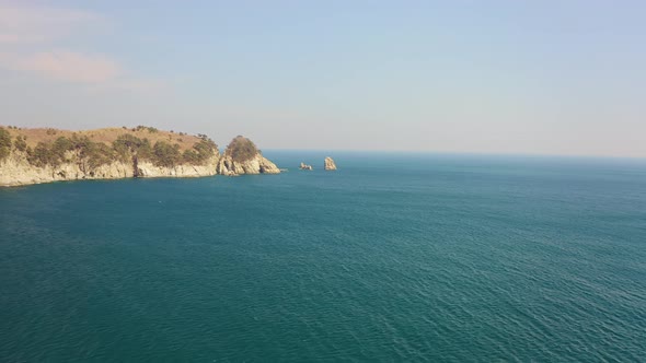 Kekura and Rocky Cape Telyakovsky Washed By the Sea of Japan on a Sunny Day